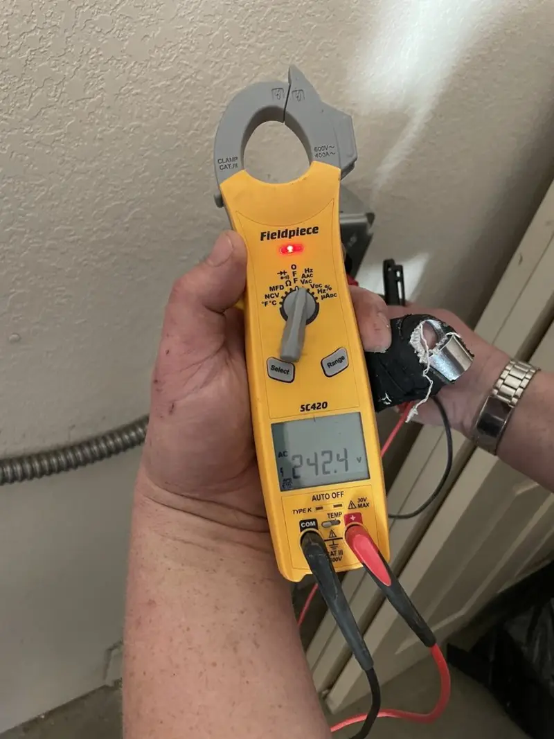 Voltage testing with clamp meter during Recessed Lighting Installation in Wildwood